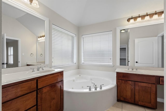 6328 Pinionpark Way, Fort Worth, TX 76179 - full bath featuring two vanities, a jetted tub, tile patterned floors, and vaulted ceiling