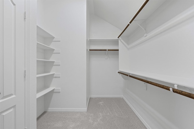 6328 Pinionpark Way, Fort Worth, TX 76179 - walk in closet with carpet floors and vaulted ceiling