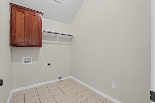 6328 Pinionpark Way, Fort Worth, TX 76179 - laundry area with washer hookup, hookup for an electric dryer, cabinet space, baseboards, and light tile patterned floors