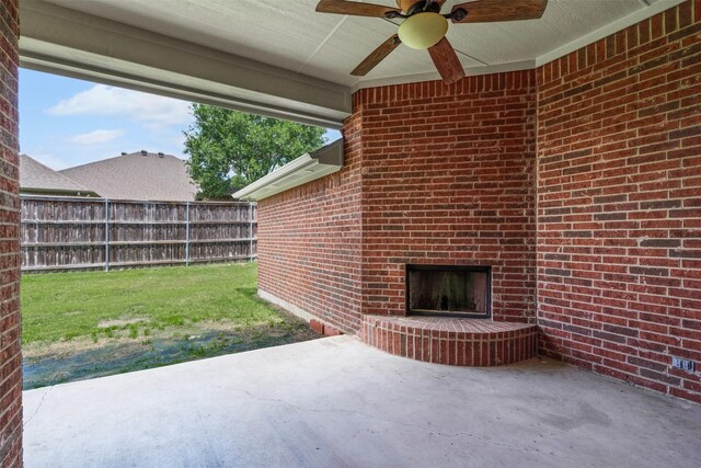 6328 Pinionpark Way, Fort Worth, TX 76179 - view of patio / terrace featuring an outdoor brick fireplace and ceiling fan