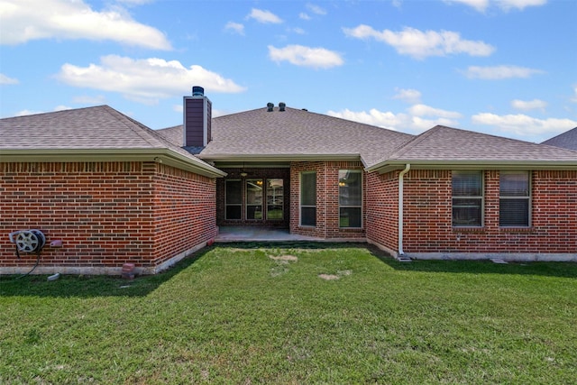 6328 Pinionpark Way, Fort Worth, TX 76179 - back of house featuring brick siding, a chimney, and a lawn
