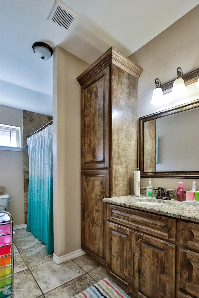 3726 Enchanted Rock Rd, Abilene, TX 79606 - full bathroom featuring tile patterned floors, a shower with shower curtain, vanity, and baseboards