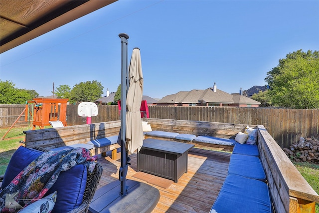 3726 Enchanted Rock Rd, Abilene, TX 79606 - wooden deck with a playground and a fenced backyard