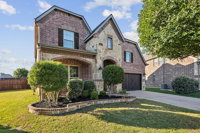 2831 Sheffield Ct, Trophy Club, TX 76262 - view of front facade with brick siding, central AC, concrete driveway, and stone siding