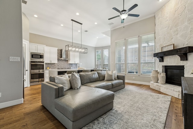2831 Sheffield Ct, Trophy Club, TX 76262 - living area with a ceiling fan, wood finished floors, recessed lighting, baseboards, and a fireplace