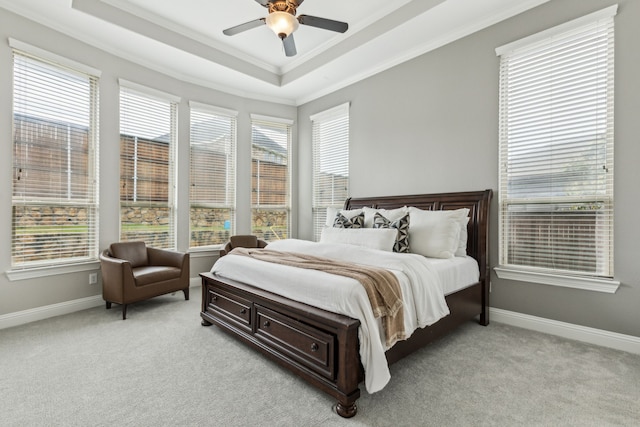 2831 Sheffield Ct, Trophy Club, TX 76262 - bedroom with ornamental molding, a tray ceiling, light carpet, baseboards, and a ceiling fan