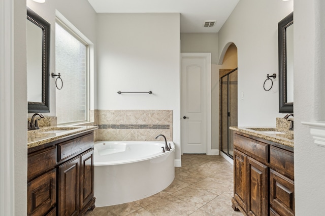 2831 Sheffield Ct, Trophy Club, TX 76262 - full bathroom featuring a stall shower, a garden tub, and two vanities