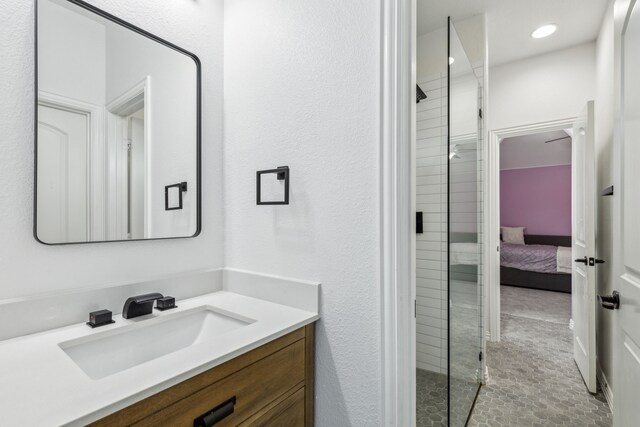 2831 Sheffield Ct, Trophy Club, TX 76262 - bathroom featuring vanity, a stall shower, connected bathroom, and tile patterned flooring