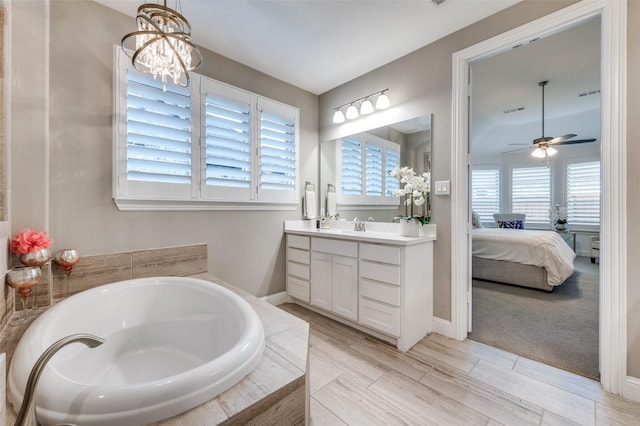 771 Drummond Dr, Prosper, TX 75078 - ensuite bathroom featuring a ceiling fan, a garden tub, vanity, and baseboards
