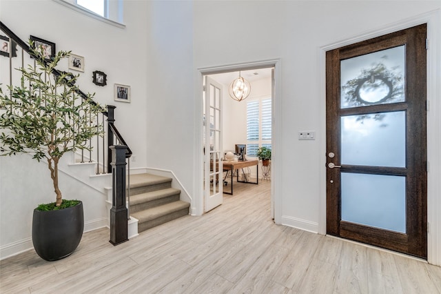 771 Drummond Dr, Prosper, TX 75078 - foyer featuring stairway, wood finished floors, healthy amount of natural light, baseboards, and a high ceiling
