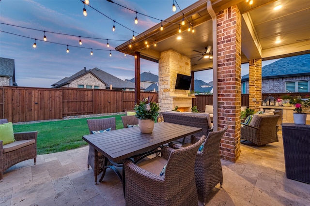 771 Drummond Dr, Prosper, TX 75078 - view of patio / terrace with an outdoor stone fireplace, outdoor dining space, and ceiling fan
