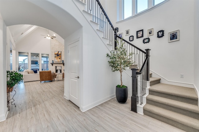 771 Drummond Dr, Prosper, TX 75078 - staircase featuring healthy amount of natural light, lofted ceiling, a ceiling fan, and wood finished floors