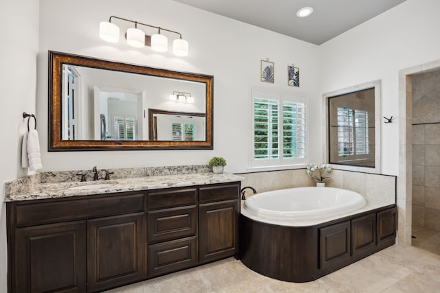 870 Swan Landing Ln, Allen, TX 75013 - full bath featuring a garden tub, vanity, and tiled shower
