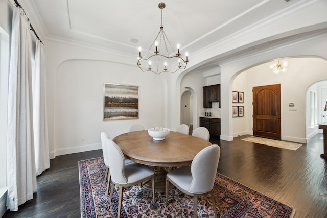 870 Swan Landing Ln, Allen, TX 75013 - dining area with arched walkways, a chandelier, dark wood-style flooring, and ornamental molding
