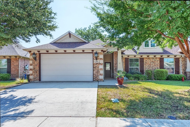 348 Terra Verde Ln, Mckinney, TX 75069 - view of front facade with a front lawn, an attached garage, driveway, and brick siding