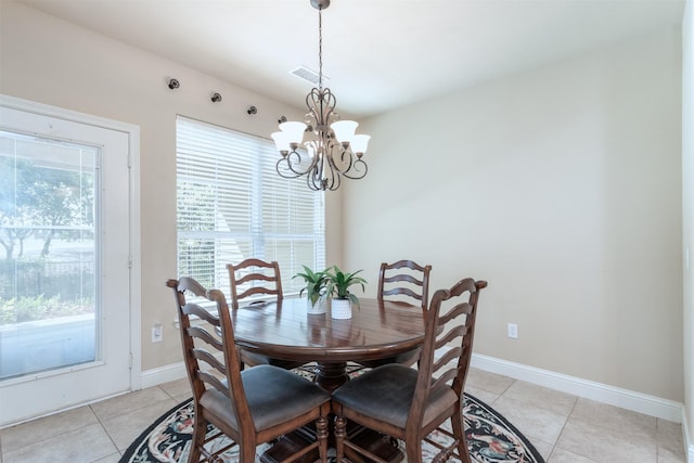 348 Terra Verde Ln, Mckinney, TX 75069 - dining space featuring a chandelier, light tile patterned floors, and baseboards