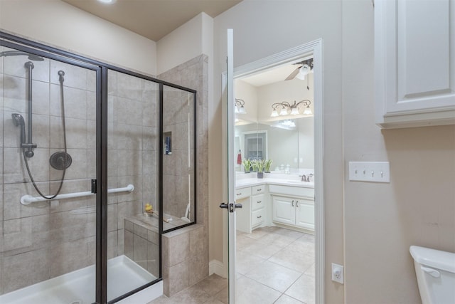 348 Terra Verde Ln, Mckinney, TX 75069 - bathroom with a stall shower, tile patterned floors, vanity, toilet, and ceiling fan