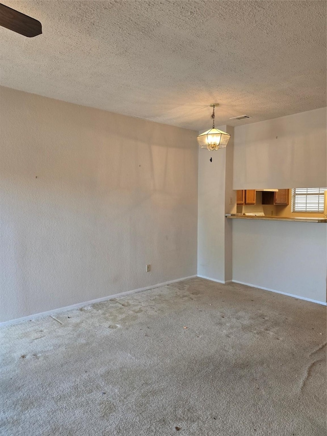 3801 14th St Unit 1004, Plano, TX 75074 - spare room with carpet floors, baseboards, and a textured ceiling