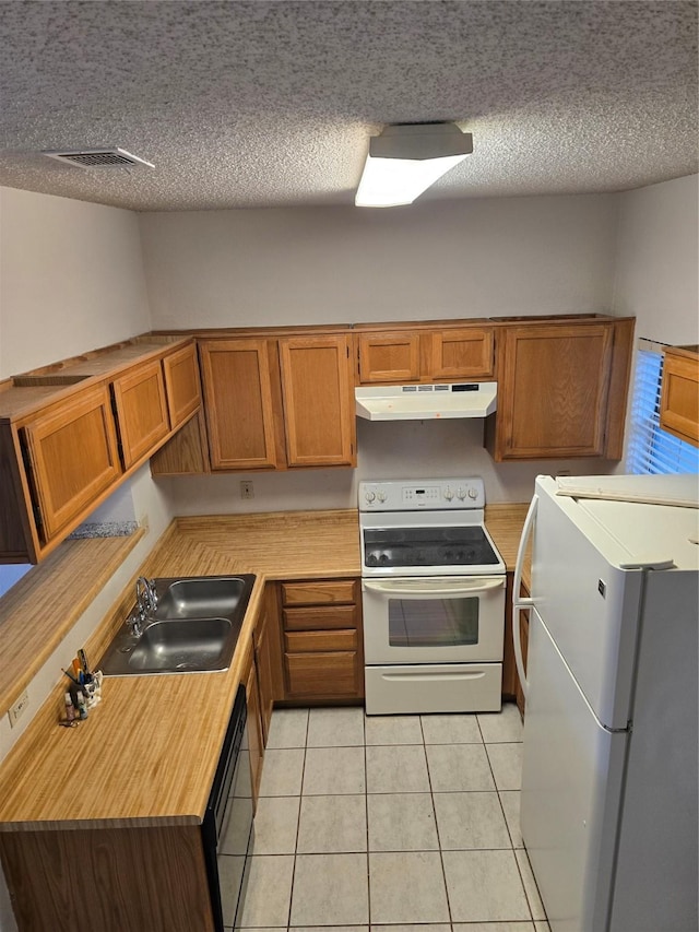 3801 14th St Unit 1004, Plano, TX 75074 - kitchen with white appliances, under cabinet range hood, a sink, a textured ceiling, and light countertops