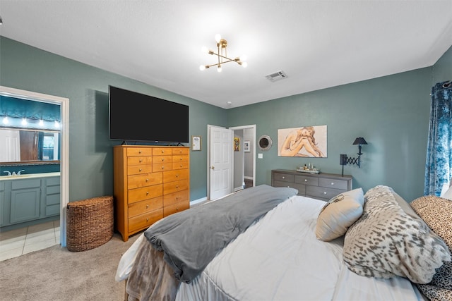 2923 Live Oak Ave, Waco, TX 76708 - bedroom featuring light colored carpet, a chandelier, ensuite bath, and a sink