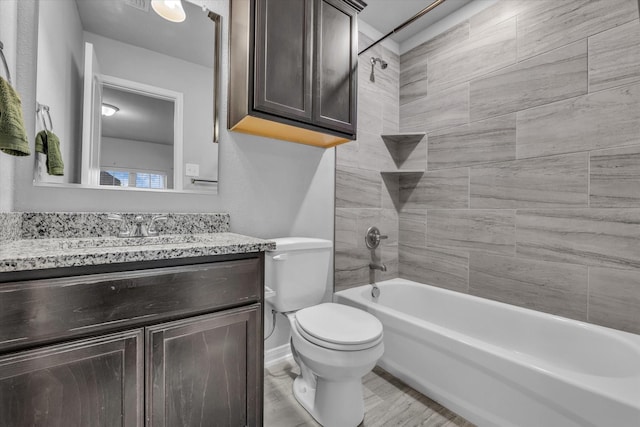 bathroom featuring shower / tub combination, toilet, vanity, and wood finished floors
