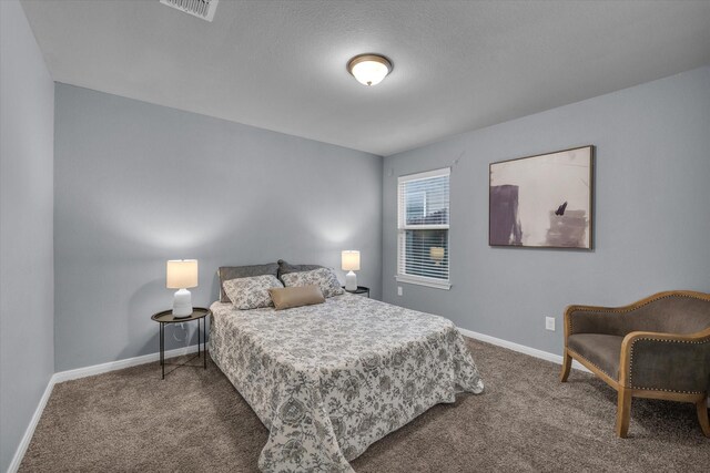 carpeted bedroom with baseboards