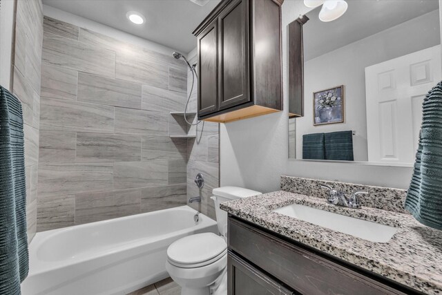 bathroom featuring bathing tub / shower combination, toilet, and vanity
