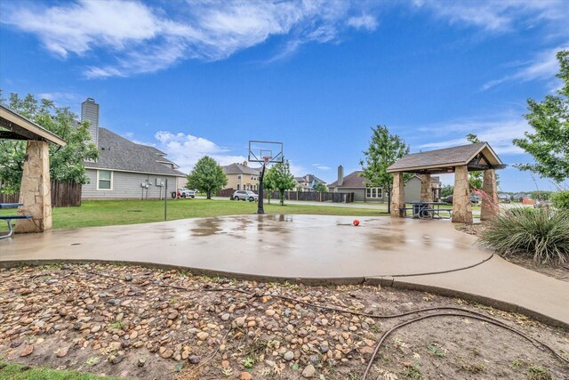 view of basketball court with a gazebo, a lawn, and a residential view