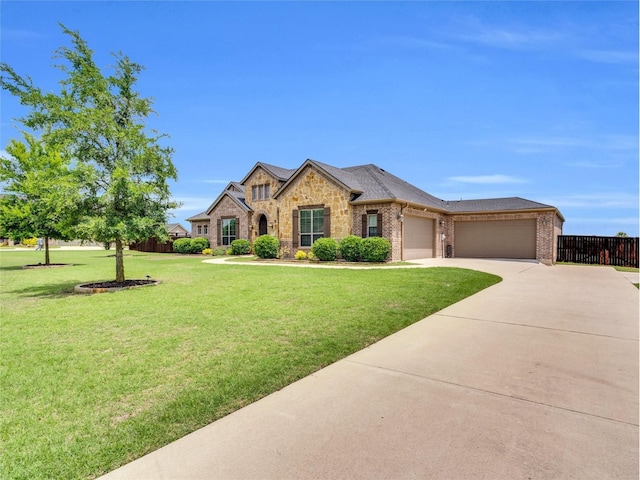 102 Willowbrook Dr, Waxahachie, TX 75165 - french country style house with an attached garage, driveway, brick siding, and stone siding