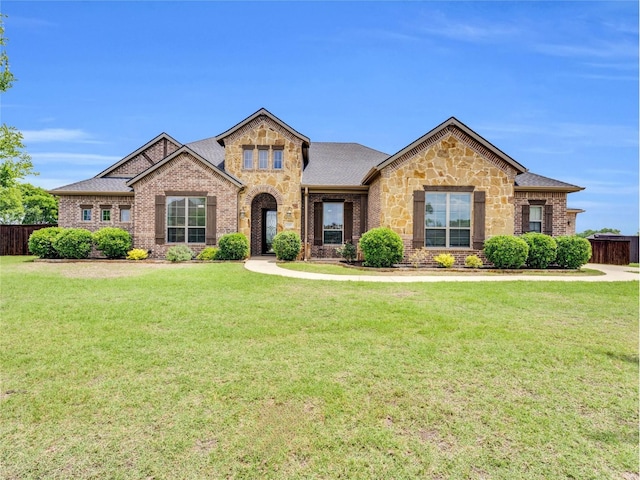 102 Willowbrook Dr, Waxahachie, TX 75165 - view of front of property featuring roof with shingles, stone siding, and brick siding