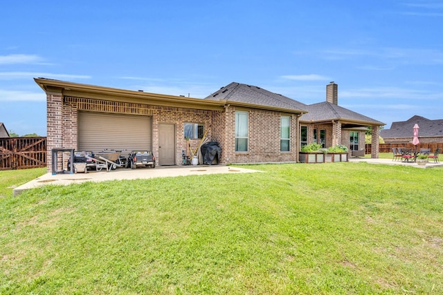 102 Willowbrook Dr, Waxahachie, TX 75165 - rear view of property with a patio, an attached garage, brick siding, and a chimney