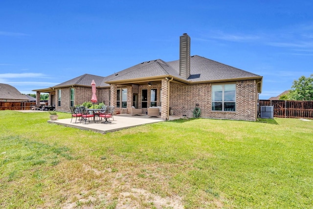 102 Willowbrook Dr, Waxahachie, TX 75165 - rear view of house featuring brick siding, a chimney, a ceiling fan, a patio, and roof with shingles