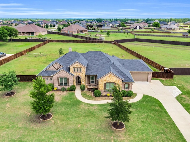 102 Willowbrook Dr, Waxahachie, TX 75165 - view of front facade featuring stone siding, driveway, and a residential view