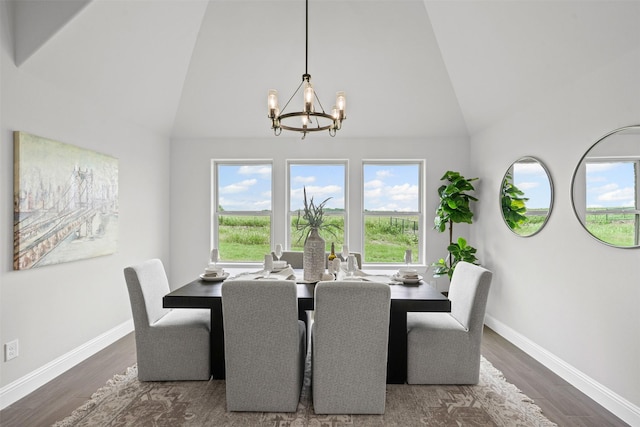 11612 Panther Dr, Godley, TX 76044 - dining space with a chandelier, high vaulted ceiling, baseboards, and wood finished floors