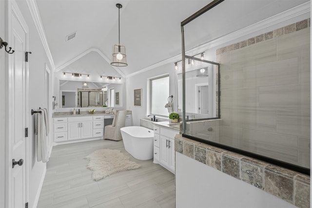 11612 Panther Dr, Godley, TX 76044 - bathroom featuring a stall shower, a freestanding tub, vanity, lofted ceiling, and crown molding