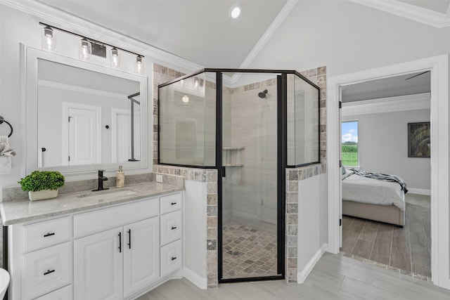 11612 Panther Dr, Godley, TX 76044 - ensuite bathroom featuring a shower stall, ornamental molding, vanity, baseboards, and lofted ceiling