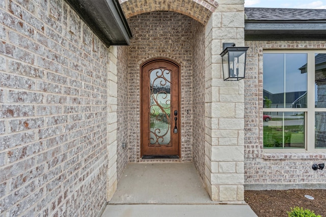 11612 Panther Dr, Godley, TX 76044 - property entrance featuring brick siding and roof with shingles