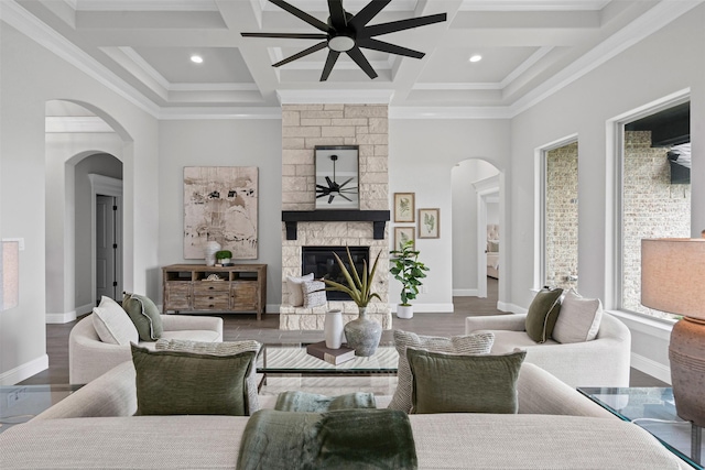 11612 Panther Dr, Godley, TX 76044 - living room featuring a ceiling fan, arched walkways, beamed ceiling, coffered ceiling, and a fireplace