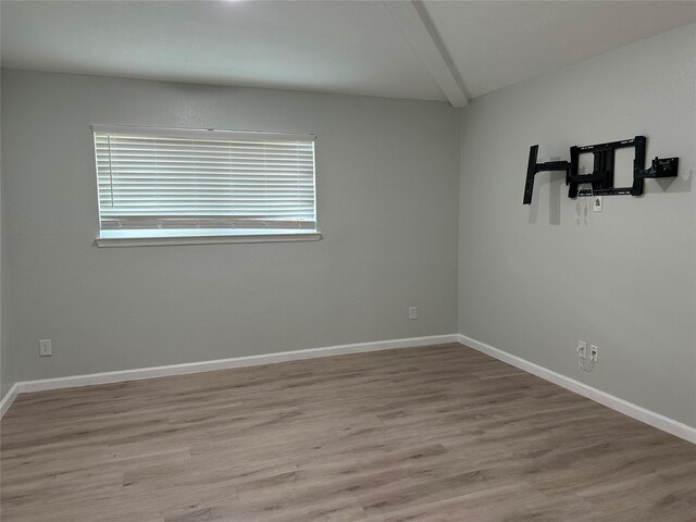 1104 Hillsdale Dr, Richardson, TX 75081 - unfurnished room featuring wood finished floors, beamed ceiling, and baseboards
