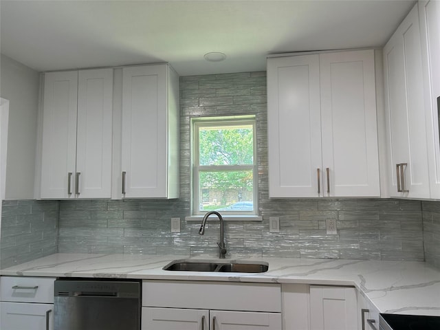 1104 Hillsdale Dr, Richardson, TX 75081 - kitchen with dishwashing machine, a sink, white cabinetry, decorative backsplash, and light stone counters