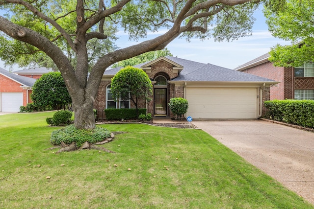 view of front facade featuring brick siding, a garage, concrete driveway, and a front lawn