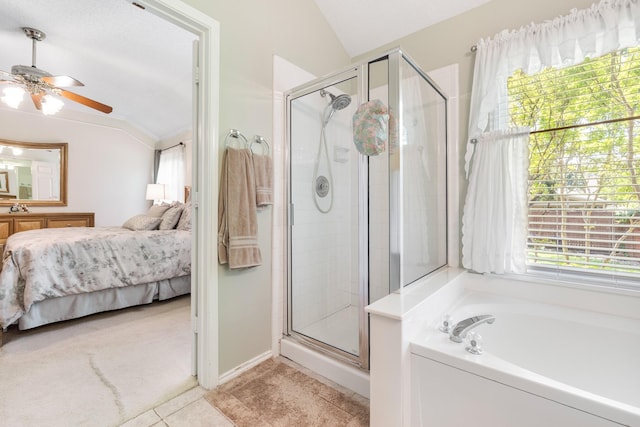 full bathroom featuring vaulted ceiling, a stall shower, ceiling fan, a bath, and vanity