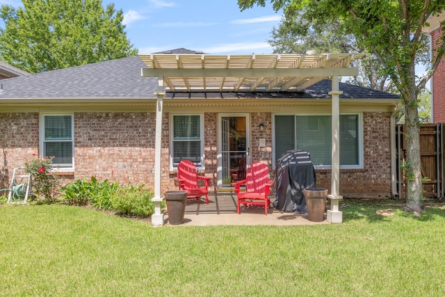 back of house with brick siding, a pergola, a patio, and roof with shingles