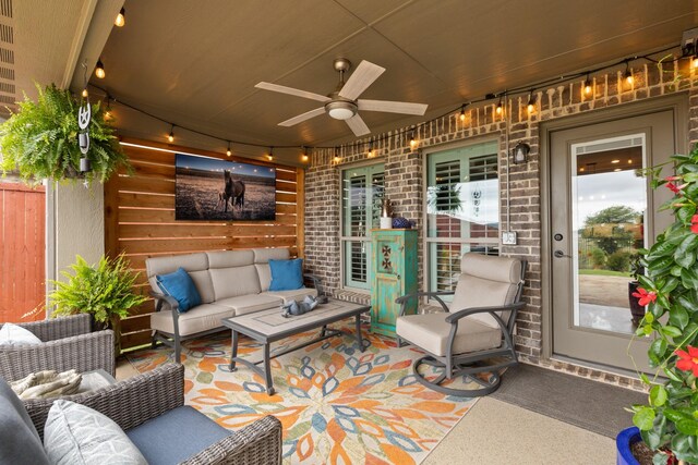view of patio featuring outdoor lounge area, ceiling fan, and fence