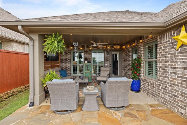 view of patio with a ceiling fan, fence, and an outdoor hangout area