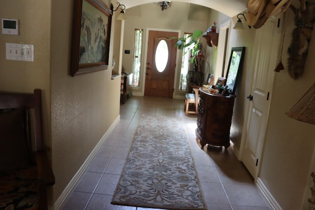 103 Apache Ct, Glen Rose, TX 76043 - tiled entryway with arched walkways and baseboards