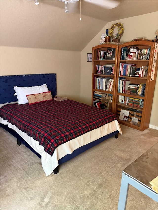 103 Apache Ct, Glen Rose, TX 76043 - bedroom with carpet, vaulted ceiling, and a ceiling fan