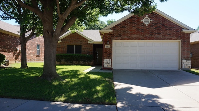 view of front facade with brick siding, concrete driveway, a front yard, and a garage