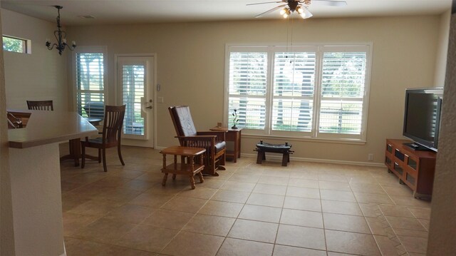 dining room featuring plenty of natural light, a ceiling fan, and light tile patterned floors