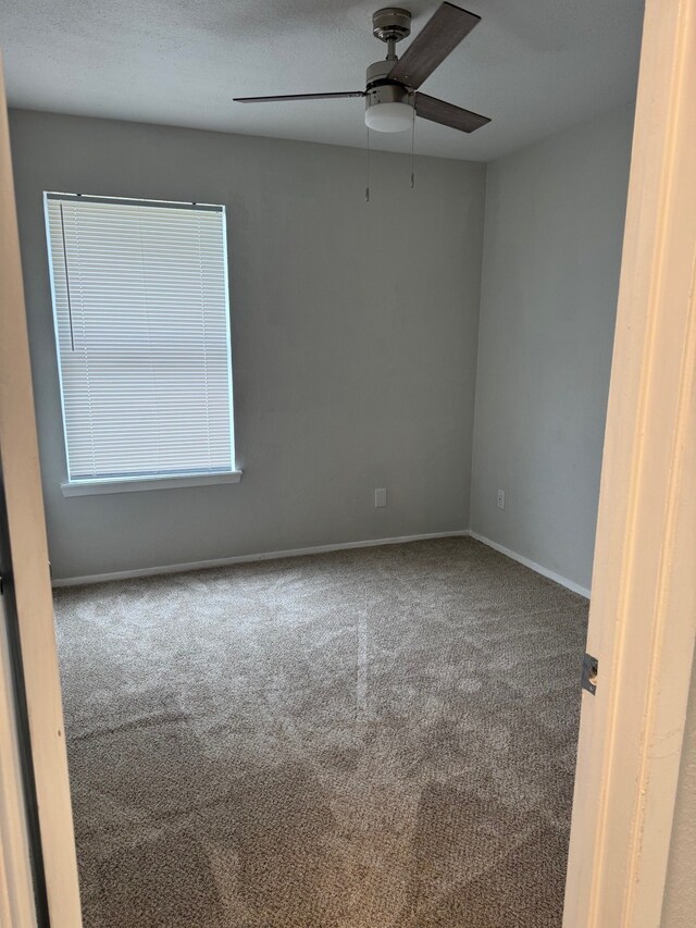 3902 Georgetown Dr, Abilene, TX 79602 - carpeted empty room featuring a ceiling fan and baseboards